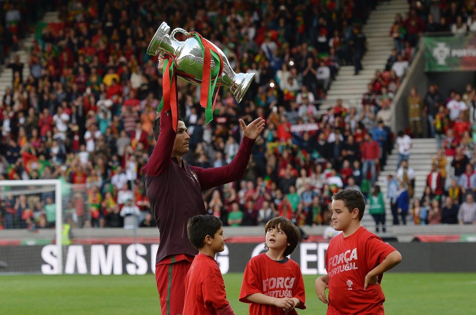  Skipper Ronaldo holds aloft the Euro 2016 trophy