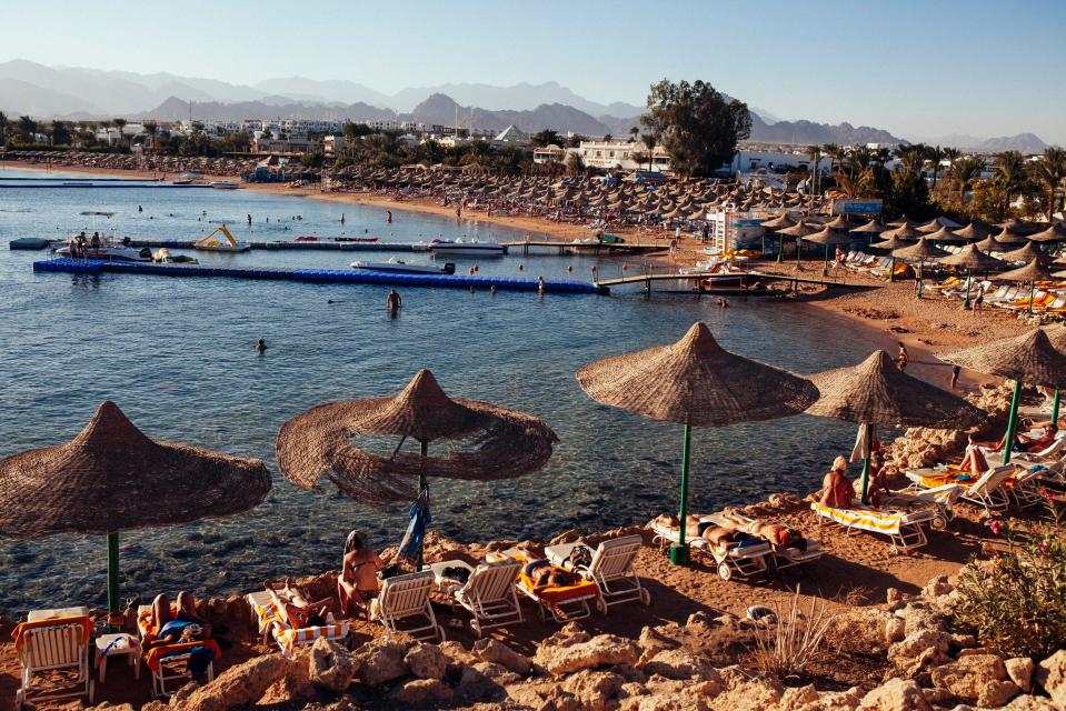  People relax on beach chairs at a beach popular with tourists in the Red Sea resort town of Sharm El Sheikh, Egypt