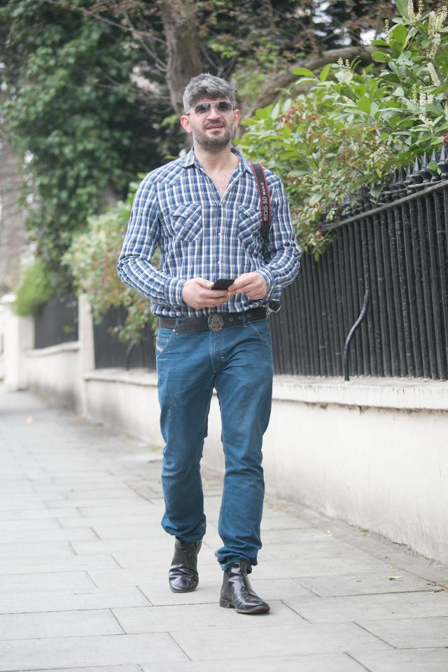  George's partner Fadi Fawaz was pictured walking in Camden on Wednesday