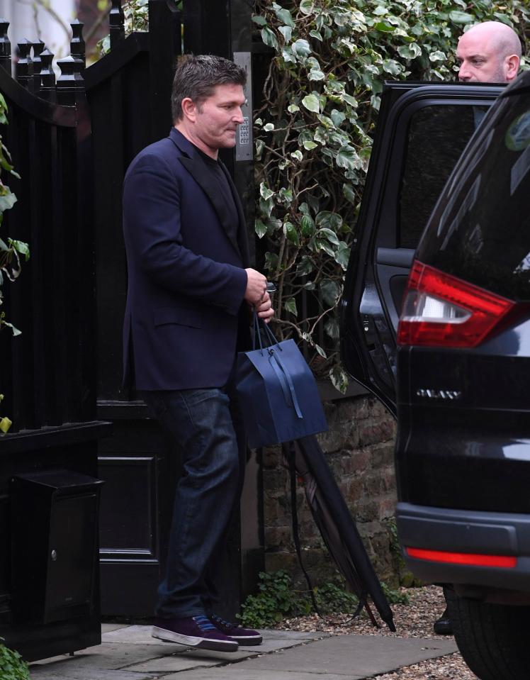  Kenny Goss looks solemn as he leaves the wake at George's home in London