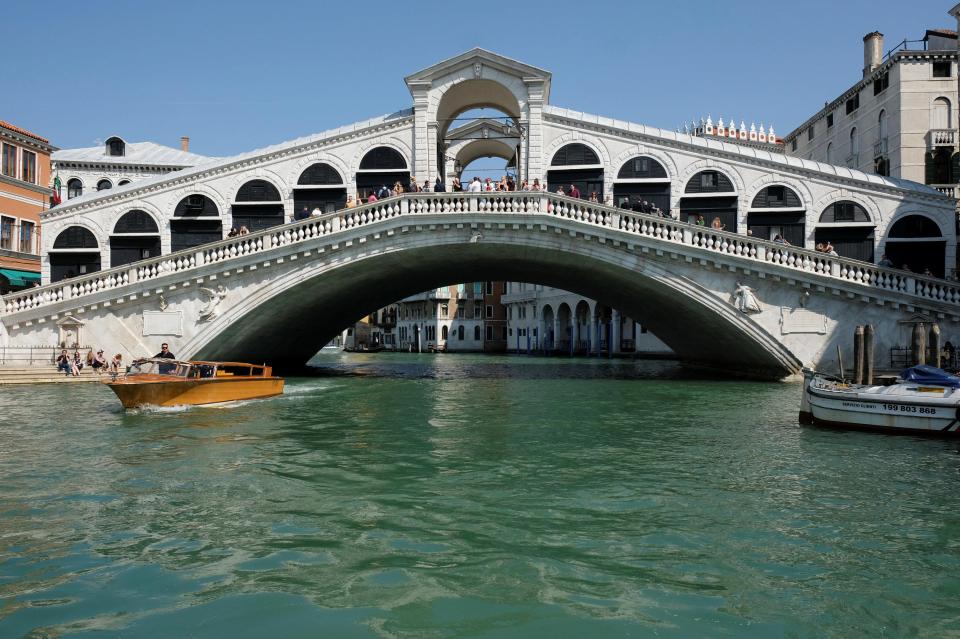  The historic Rialto Bridge is one of Venice's most popular sites and is walked over by thousands of people every day