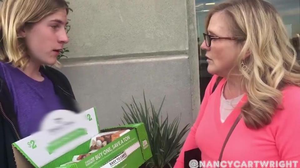  The teen referred to only as James is seen trying to sell boxes of cookies for a school fundraiser