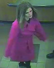  The footage shows Samantha Baldwin wearing a bright pink/red trench coat