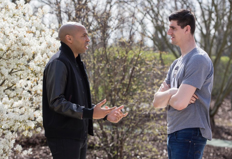  Courtois had spring in his step when he chatted with Arsenal legend Henry