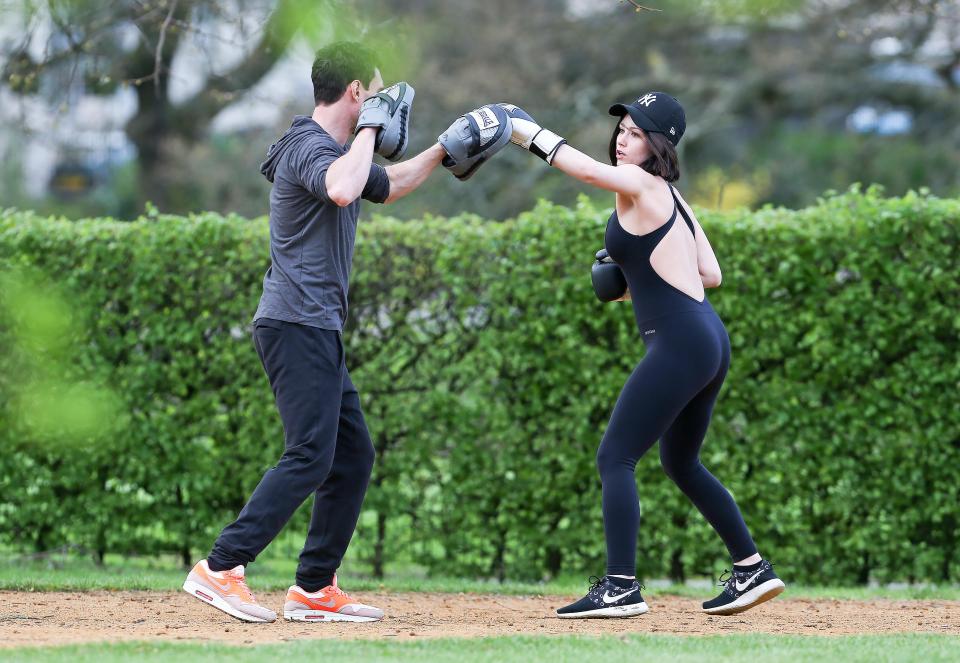  Catherine - who goes by the name Cat Cavelli - worked up a sweat in a boxing session