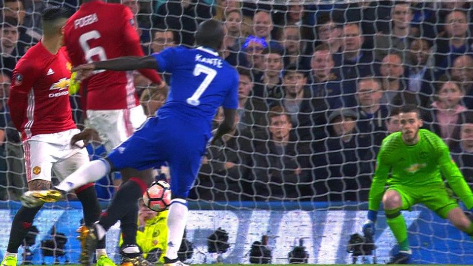 N'Golo Kante watches his strike fly past David de Gea in the Man United goal