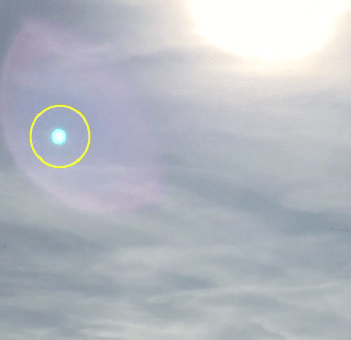  Amy believes that the orb of light, circled, is her son's guardian angel