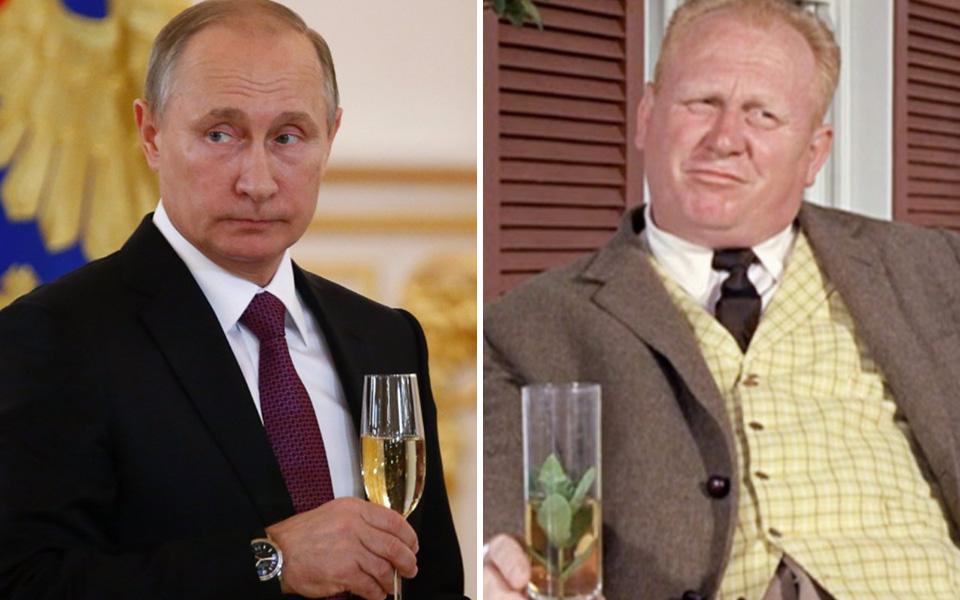  The Russian president holds a glass during a reception at the Kremlin last year, glaring from the corner of his eye like Auric Goldfinger