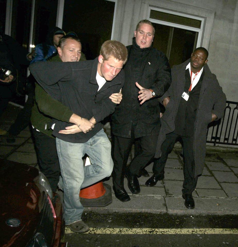  Prince Harry being led out of a club by bouncers back in 2004