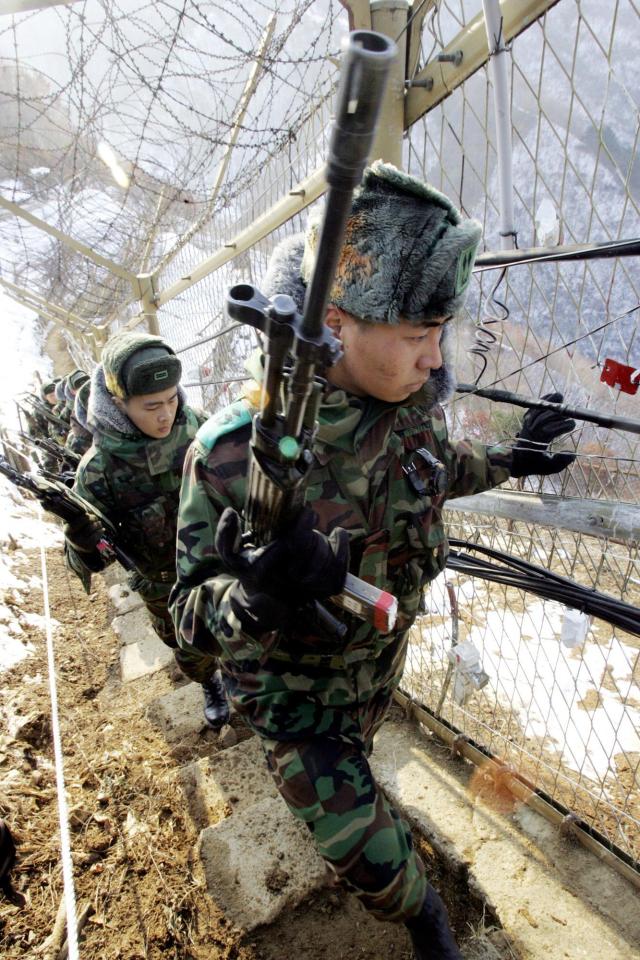  A South Korean soldier patrols the edge of the DMZ