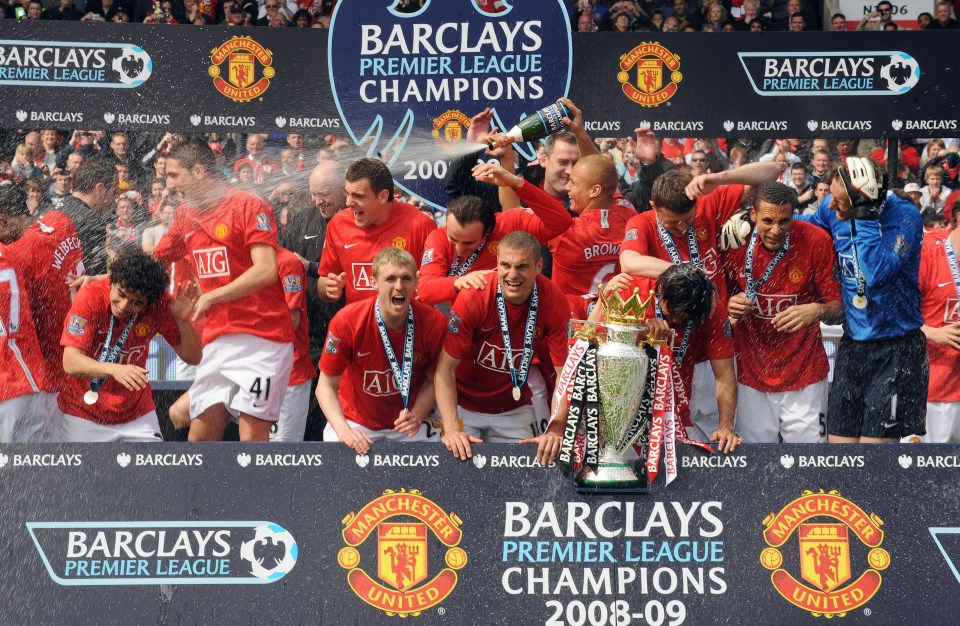 Manchester United players celebrate a third-consecutive Premier League title