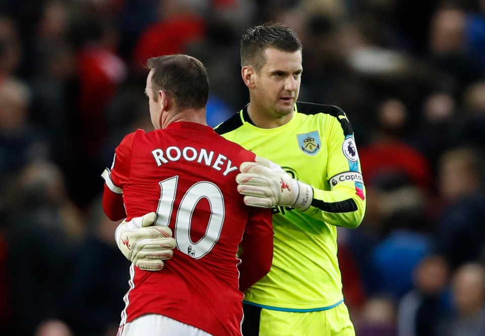 Tom Heaton hugged Wayne Rooney during their league match against Man Utd