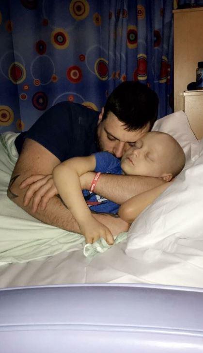  Bradley with his dad last year during a hospital stay