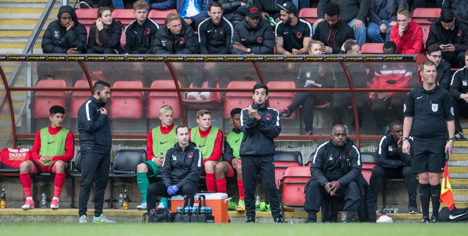  Leyton Orient's Under-16s manager Frederico Morais (middle) was forced to take charge of the senior team in the second half against Wycombe