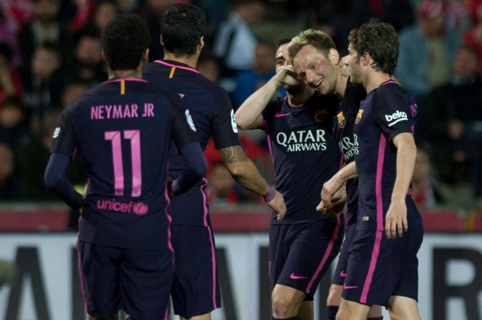  Ivan Rakitic celebrated with his Barcelona team-mates after his deflected goal