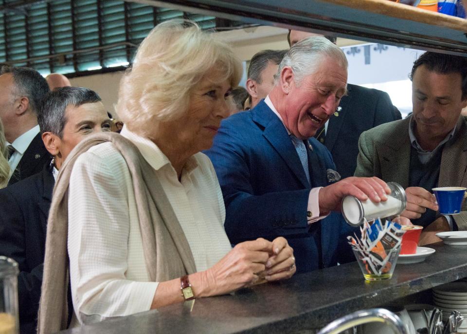  Lady in waiting ... Prince Charles is served his coffee while Camilla is left waiting for her order