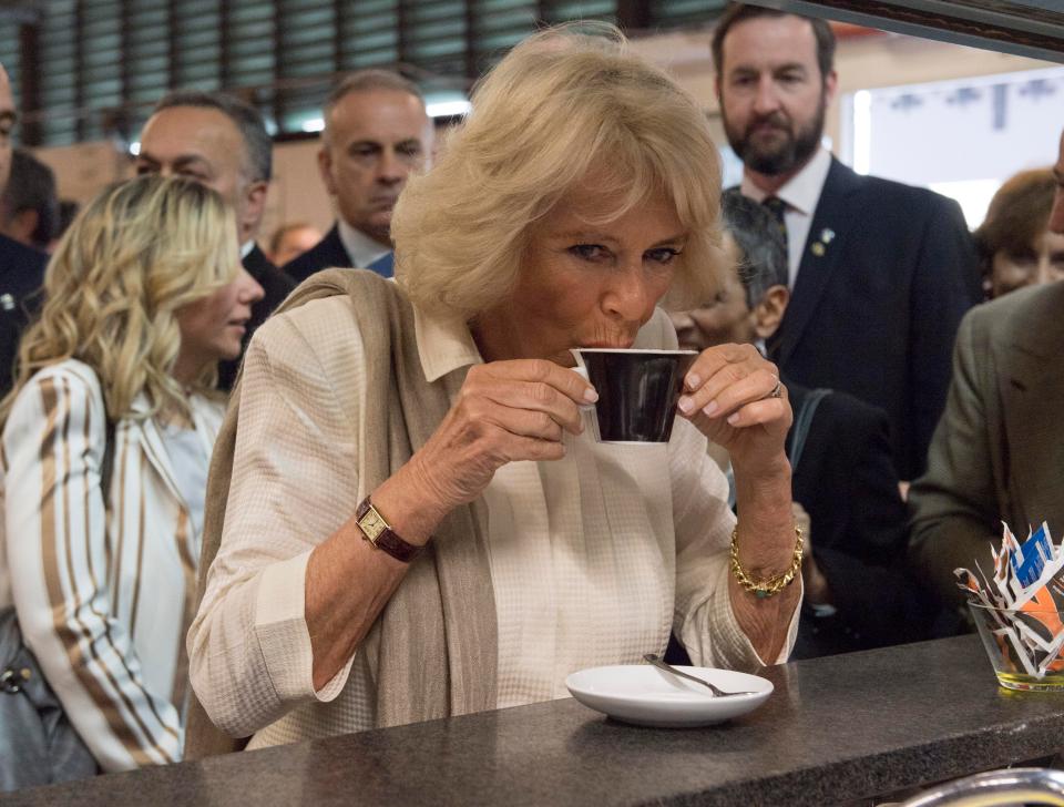  At last ... The Duchess of Cornwall tastes her long awaited coffee