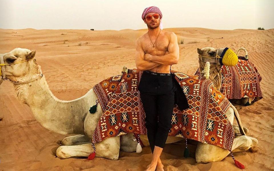  Zac with camels in Dubai