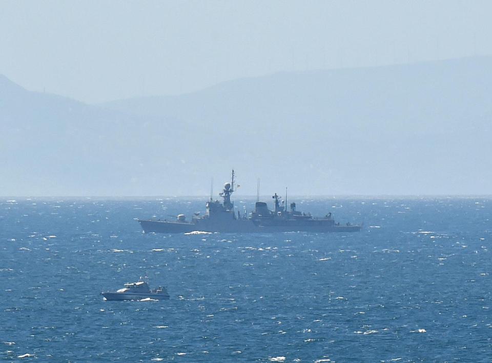 The HMS Scimitar (small boat on the left) pictured during the dramatic face off with the Spanish patrol boat on April 4