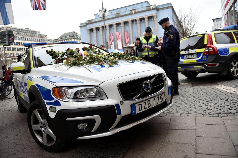 The public laid flowers on emergency vehicles in Stockholm the day after a terror attack in the city