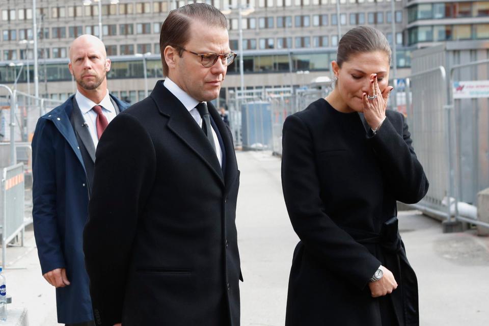 Crown Princess Victoria of Sweden sheds a tear as she visits the crime scene with Prince Daniel 