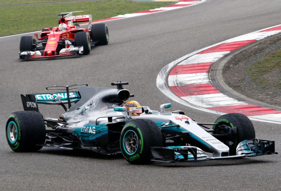  Lewis Hamilton leads from Sebastian Vettel during Sunday's race in China