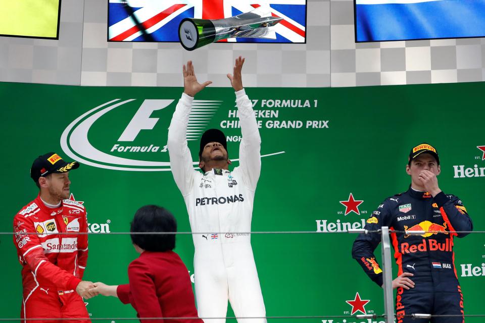  Lewis Hamilton on the top step ahead of Sebastian Vettel (left) and Max Verstappen (right)