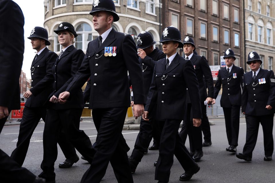 Police officers pictured walking towards Southwark Cathedral as they prepared for PC Palmer's funeral