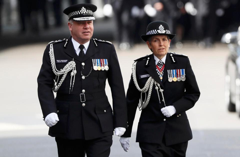 Cressida Dick the new Commissioner of the Metropolitan Police arrives on her first day in the job with another police officer 