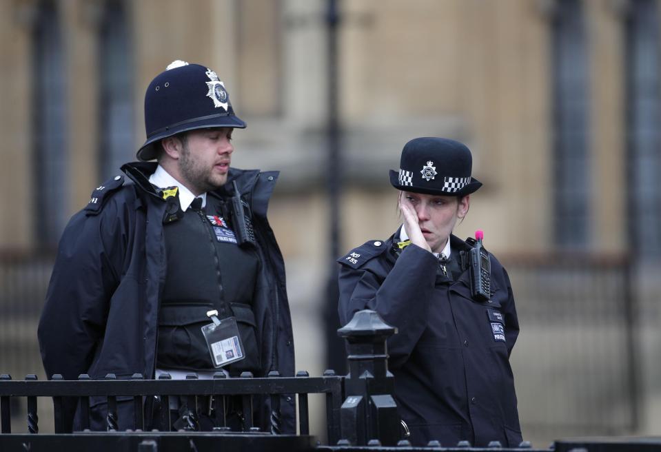 Police officers were visibly moved as they watched the funeral preparations for PC Palmer