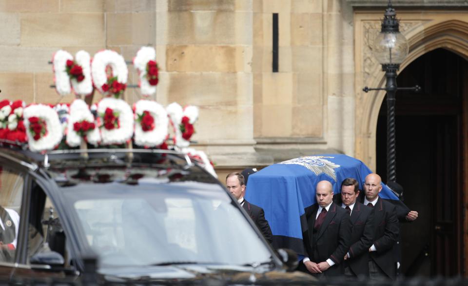 PC Palmer's coffin is carried to the hearse 