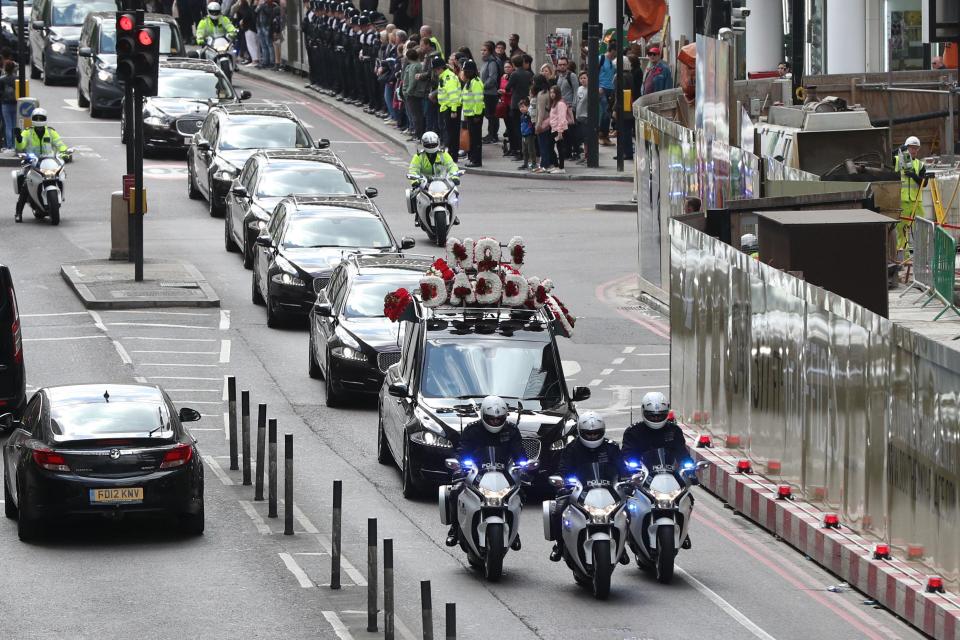 Police flanked the hearse as members of PC Palmer's family were believed to be in black people carriers travelling behind