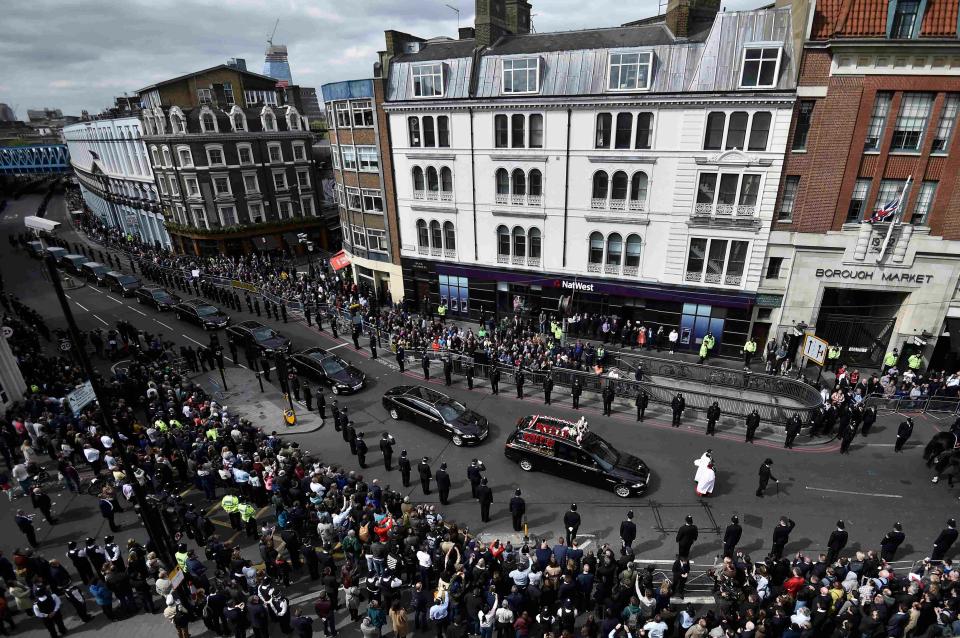 Police officers line the route in London ahead of the funeral at Southwark Cathedral 