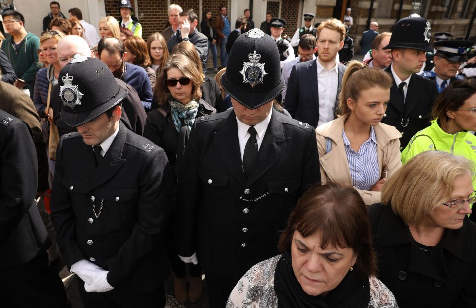 Police officers joined the crowds of mourners who came to watch the procession for PC Palmer