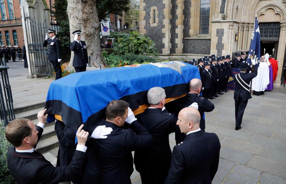 PC Palmer's coffin is carried into Southwark Cathedral ahead of the service