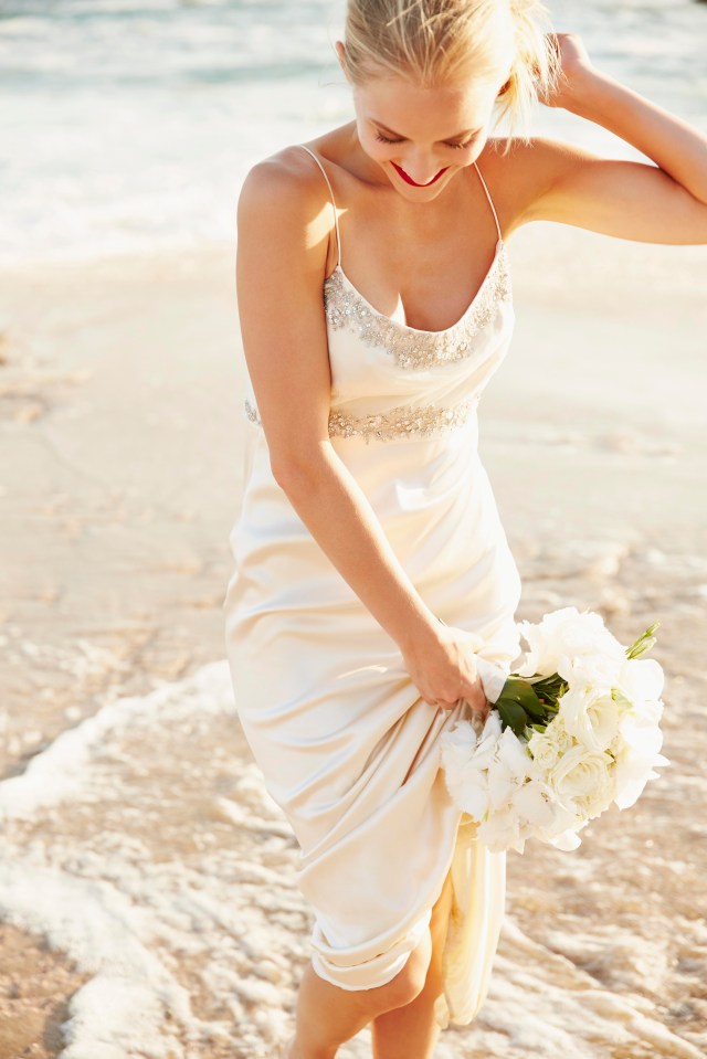 Brides-to-be have turned to the high-street for thrifty dress options, rather than shopping designer labels (Picture posed by model)