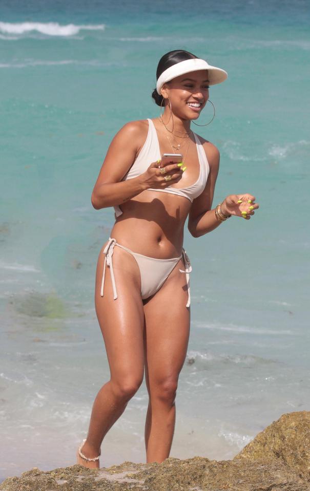  Karrueche smiled as she played on her phone