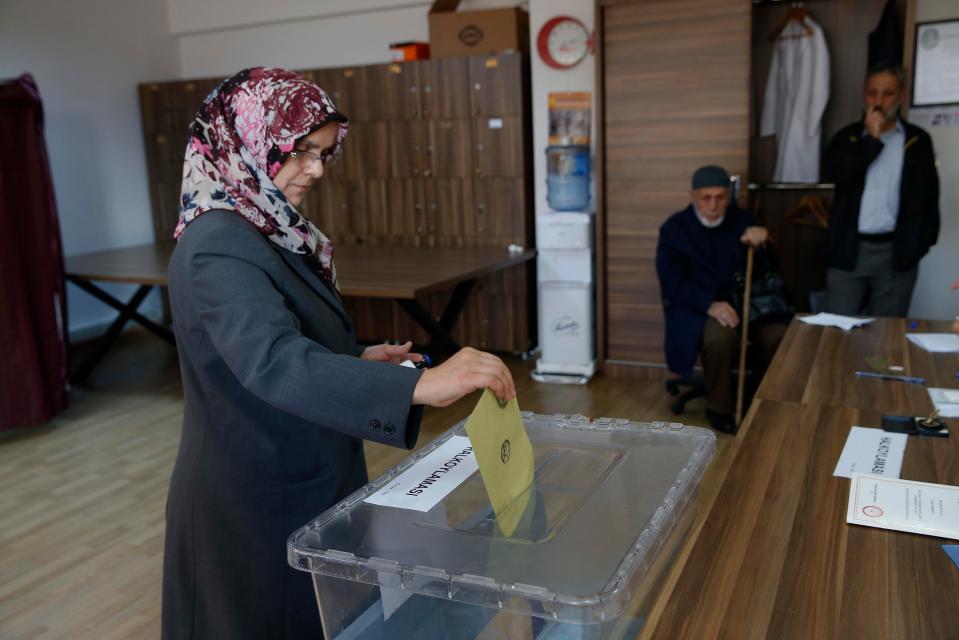 A woman casts her ballot inside a polling station in the city of Istanbul