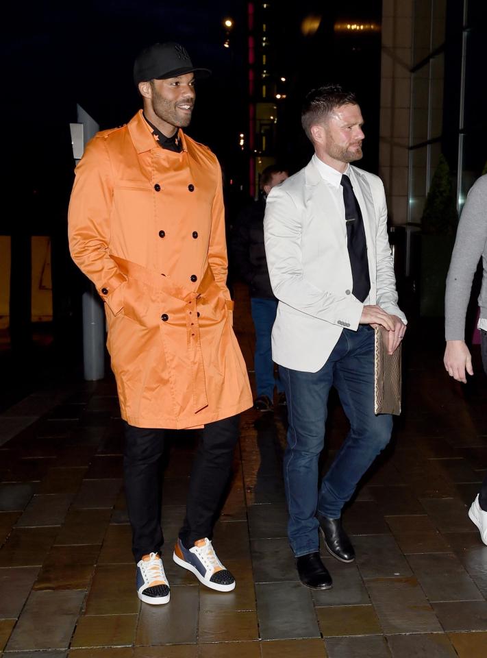  Joleon Lescott wore a vibrant orange jacket to the birthday bash