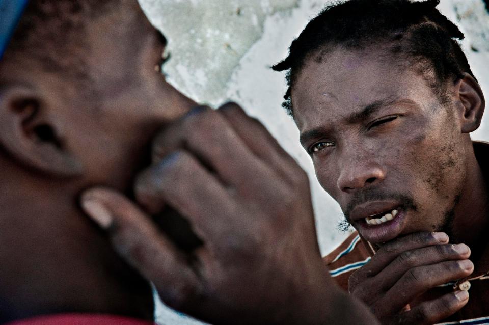  Franz (right) and Wilner, 26 and 22 years, belongs to the gang of the ghetto named Boston from one year and few months.Franz has lost his brother last year killed by an opposite gang