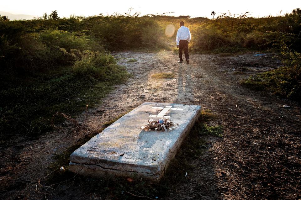  "Le Champ" (The field), the unofficial cemetery in Cite Soleil - The grave of Willy, the historic leader of one of the most powerful gangs armed by President Aristide in the 90s