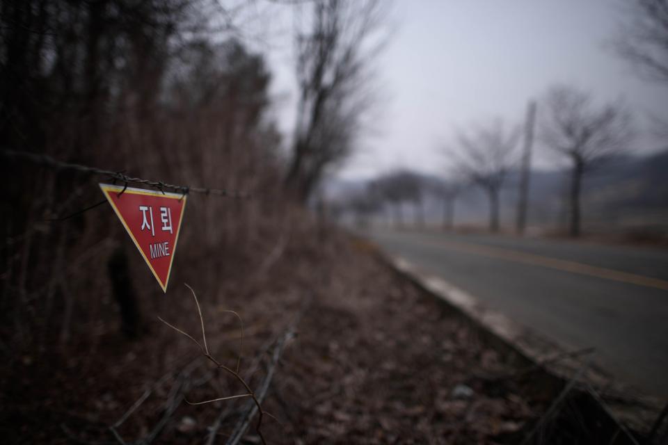  A solitary sign warns of the presence of landmines