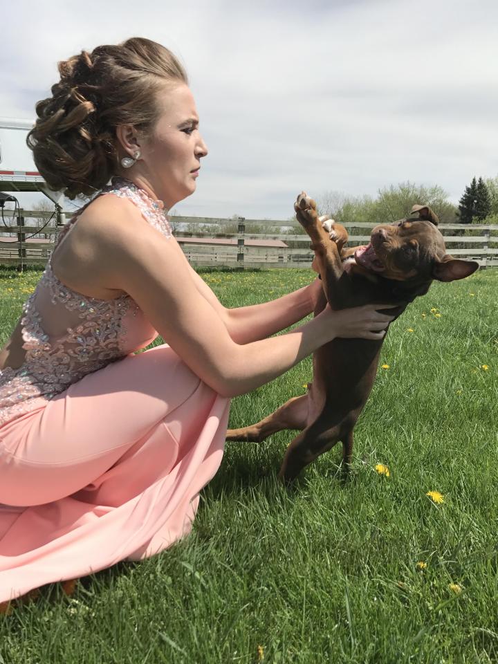  Kaycee, dressed in her prom gown, leaned in for a kiss with Doobie in the hope of a picture she could treasure