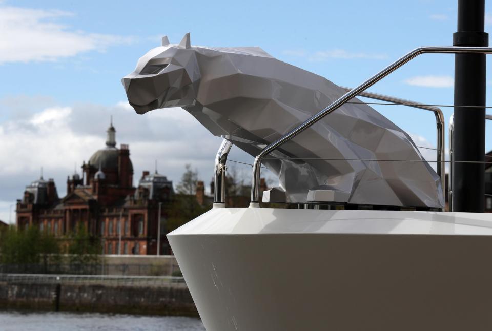  The figurehead on the boat's prow is a stylised cat-like creature