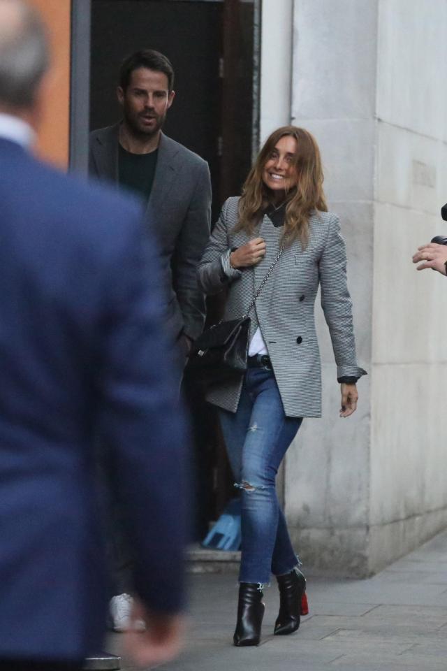  The former singer kept a smile on her face as she walked along the street with Jamie, who looked dapper in a smart suit jacket