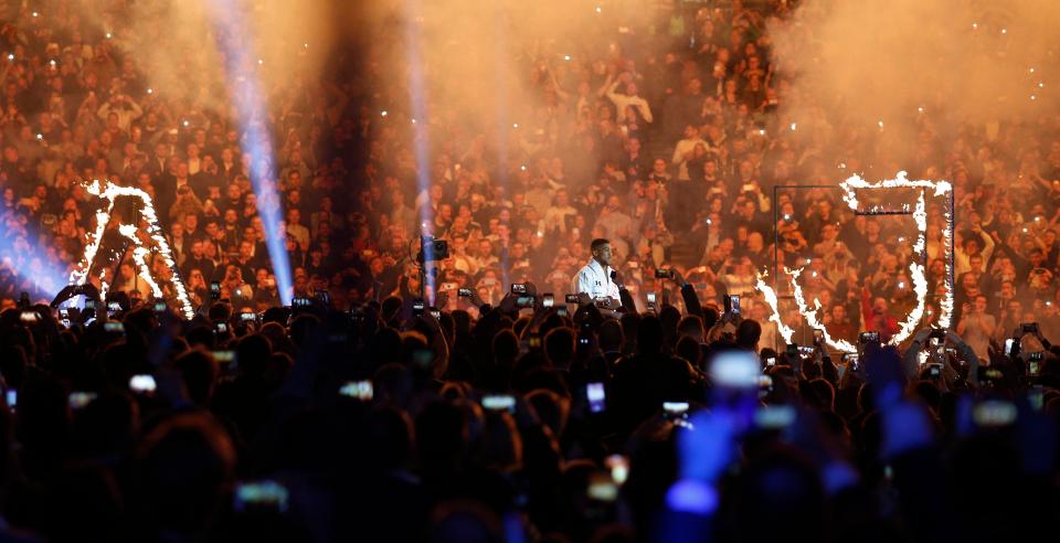  The Brit walked to the ring in a white robe