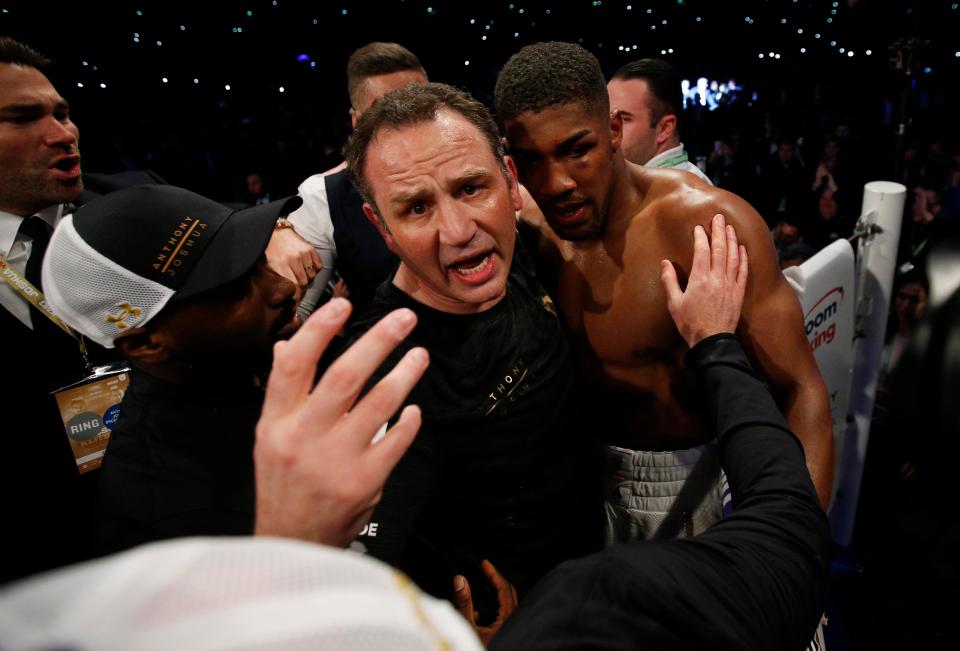  Anthony Joshua was embraced by his trainer Rob McCracken