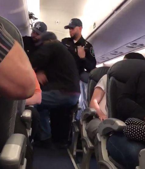  Officials were first seen trying to wrench the man from his seat on a United Airlines flight in April