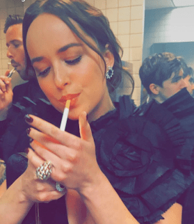  Dakota Johnson didn't hesitate to light up as the crammed toilets were filled with stars