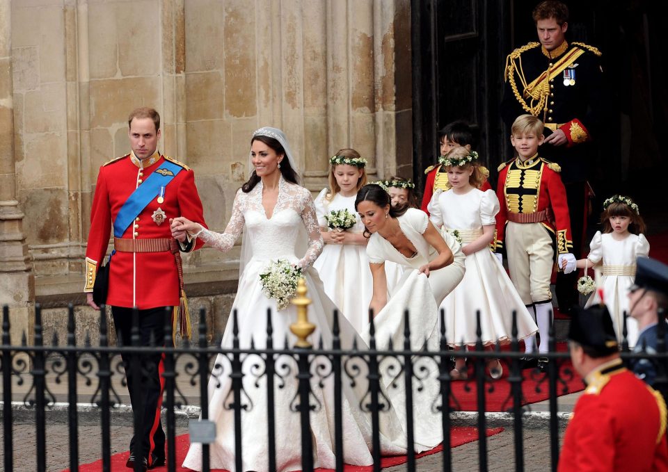  Pippa tends to sister Kate's dramatic Alexander McQueen train at London's Westminster Abbey during the Royal Wedding in 2011